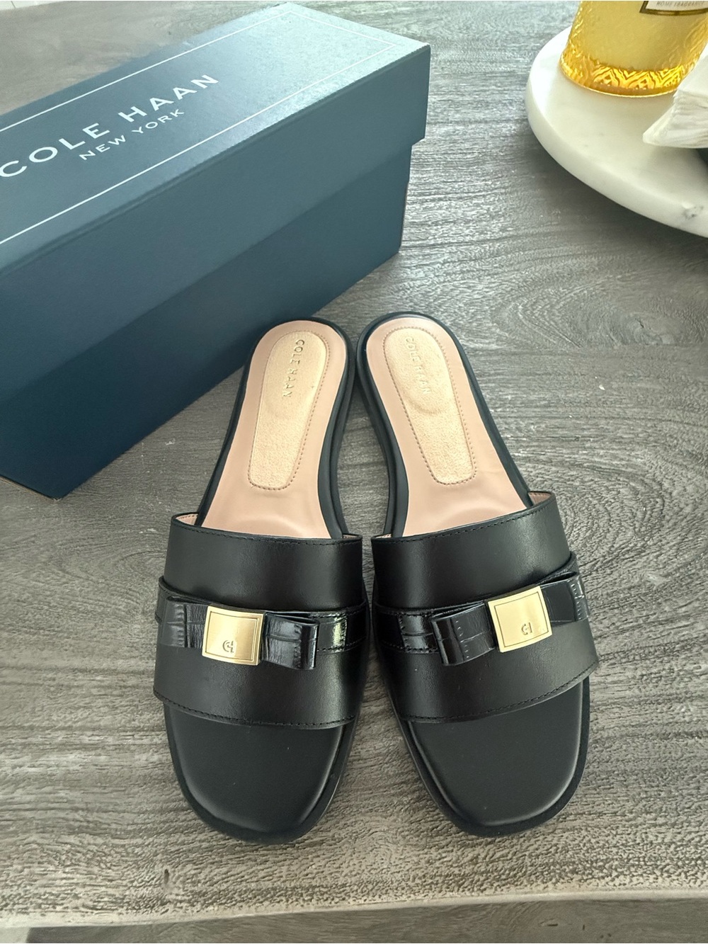 Cole Haan Black Leather Slide Mules with Gold Plaque